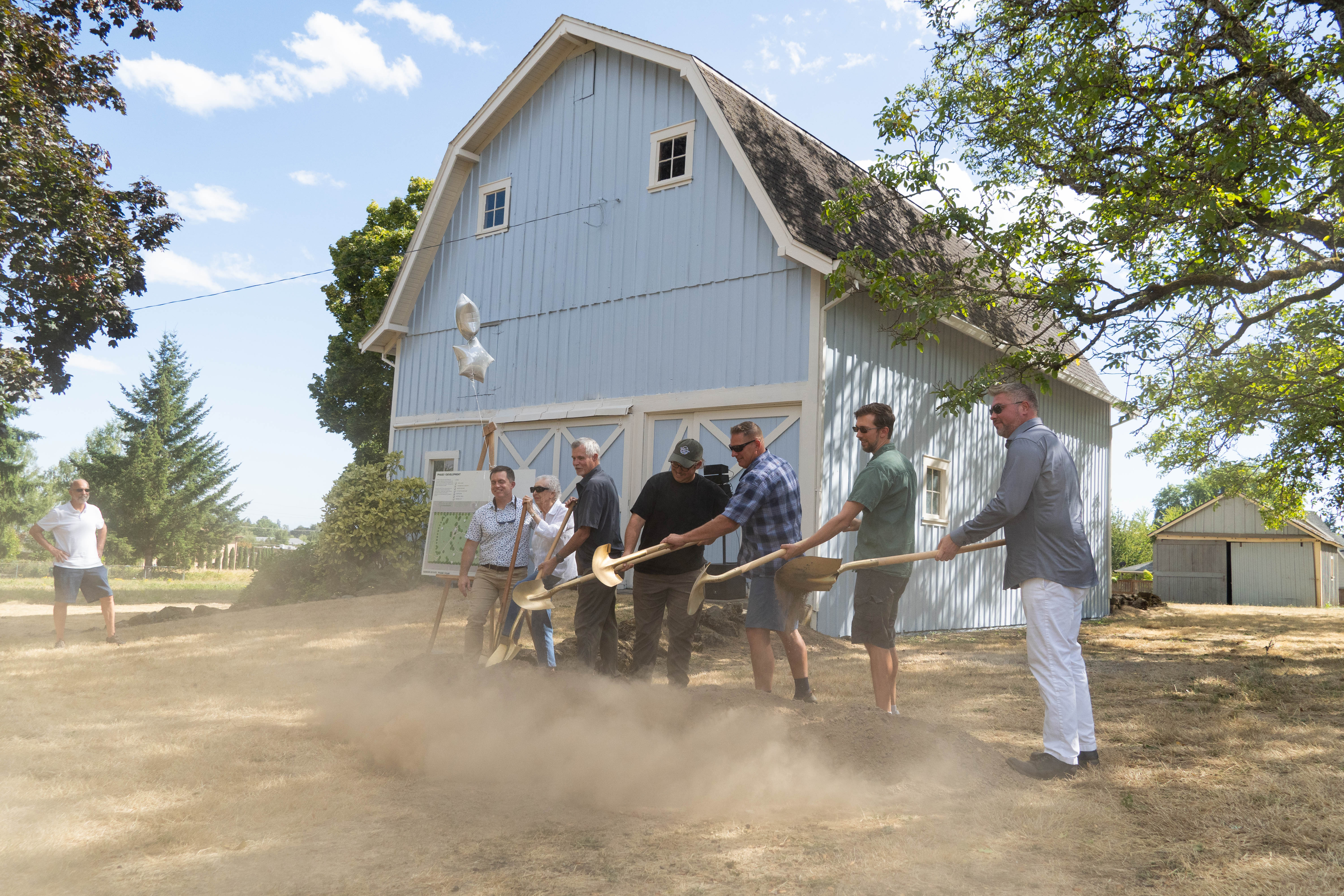 Members of the CPRD Board of Directors alongside land donor Jan Sander shove the first scoops of dirt during the Sander Park Groundbreaking in Dundee on Aug. 13. (Branden Andersen)